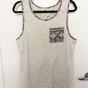 On the Byas Men’s Medium White pocket tee tank top with geometric tribal trim